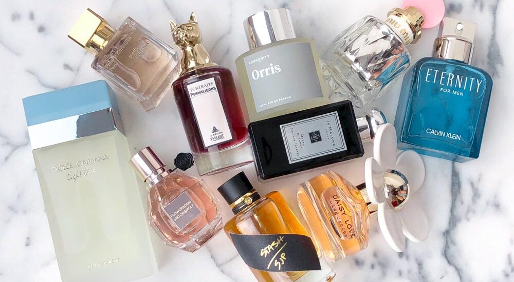 Elegant display of imported perfume bottles arranged on a luxurious surface, highlighting their premium packaging and sophisticated design.