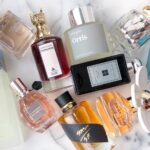 Elegant display of imported perfume bottles arranged on a luxurious surface, highlighting their premium packaging and sophisticated design.