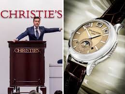“A display of rare, luxurious watches sold at record-breaking prices at an auction, featuring vintage and limited-edition timepieces in pristine condition.”
