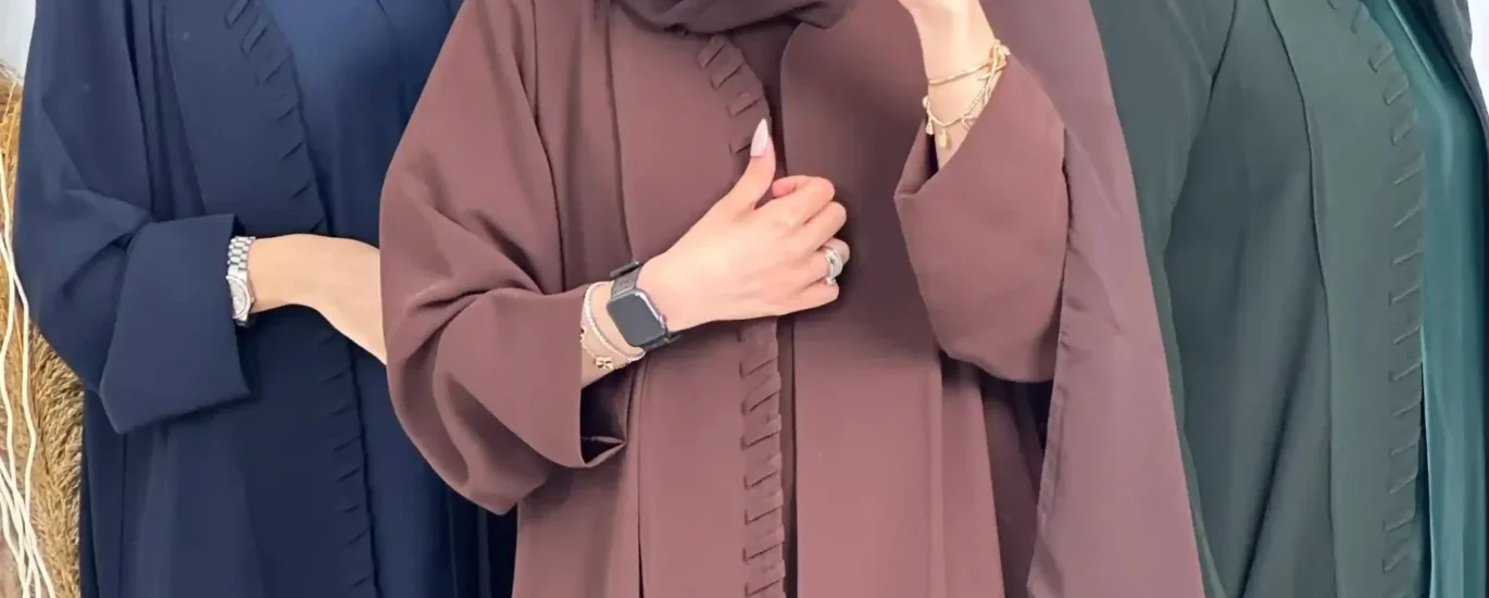 Elegant abayas from top modest fashion brands in 2025, showcasing modern designs and luxurious fabrics.