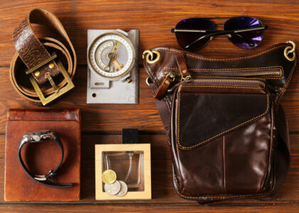 "2025 accessory trends featuring bold jewelry, statement belts, tech-integrated bags, and stylish sunglasses"