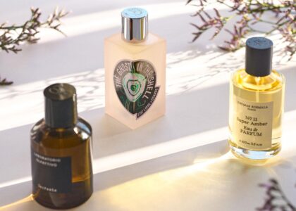 "Exclusive 2025 niche perfumes with artisanal bottles and rare ingredients symbolizing luxury and individuality"