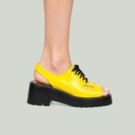 A pair of bold, chunky retro sneakers in vibrant colors representing 2025 trending footwear styles.