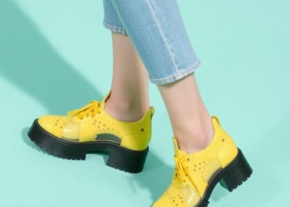 "Trendy 2025 footwear styles including chunky sneakers, futuristic heels, and eco-friendly shoes for men and women"