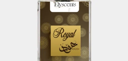 Elegant glass bottle of Royal Oud Elyscents fragrance surrounded by oud wood chips and amber, symbolizing luxury and warmth.