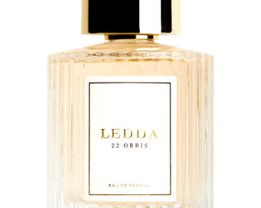 14 Isla Coco perfume bottle with tropical leaves and beach background