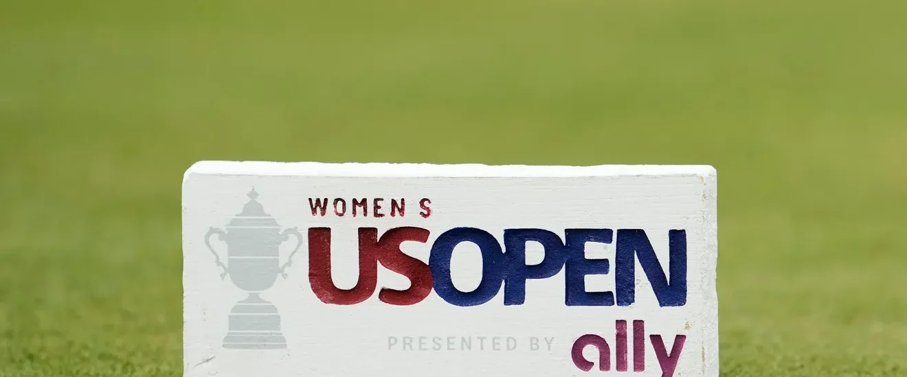 Two golfers competing in the U.S. Women’s Open playoff format, showcasing intense competition and sportsmanship