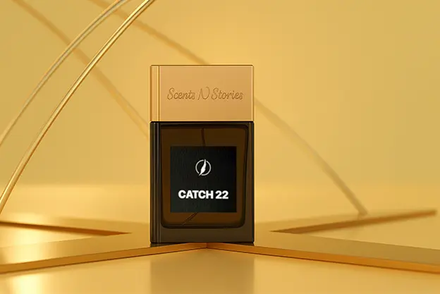 Flatlay of Catch 22 - Gold Edition Scents N Stories bottle with golden reflections on a marble surface, styled with minimal accessories