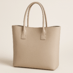 A classic tote bag placed stylishly on an outdoor café table in daylight.