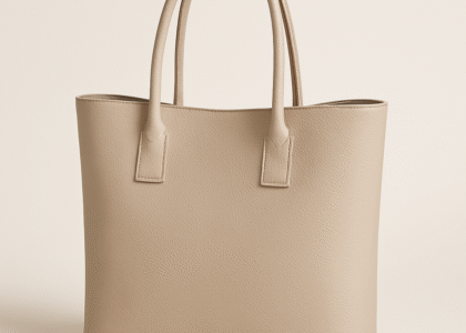 A classic tote bag placed stylishly on an outdoor café table in daylight.