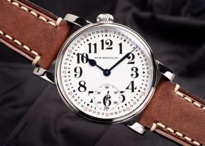 Close-up of an RGM watch dial showcasing intricate hand-engraving and classic American craftsmanship