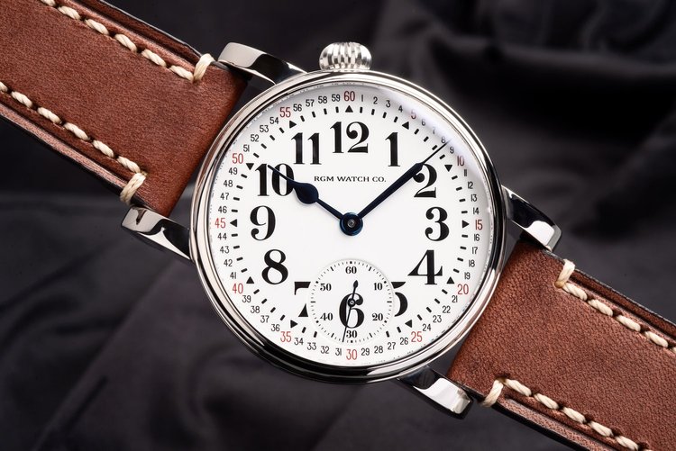 Close-up of an RGM watch dial showcasing intricate hand-engraving and classic American craftsmanship