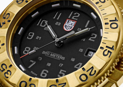 Close-up of the Luminox Navy SEAL Foundation Watch with gold-accented dial and Carbonox case, symbolizing honor and rugged elegance
