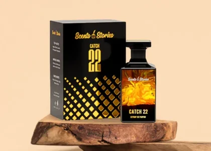 Bottle of Catch 22 perfume placed on a wooden table, with soft lighting highlighting the label – a perfect everyday fragrance for men and women in Pakistan