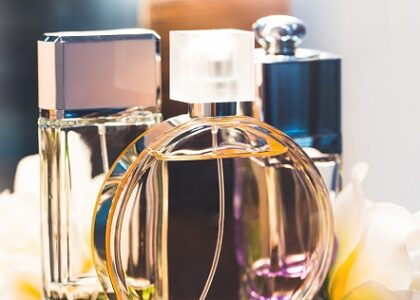 Elegant bottle of Notes to Self fragrance by Byza placed on a minimal wooden table with soft natural light, evoking calm and introspection.