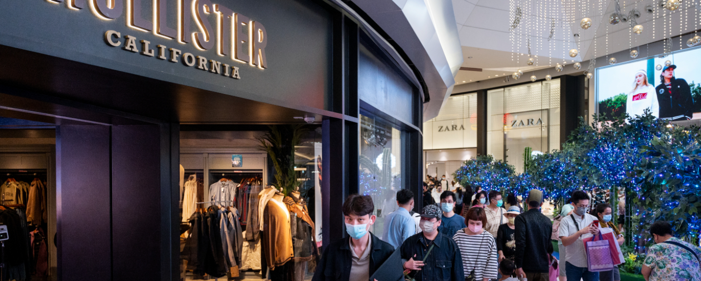 Pakistani youth wearing Hollister t-shirt and jeans in modern streetwear style.