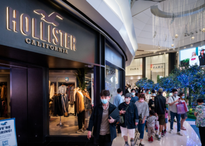 Pakistani youth wearing Hollister t-shirt and jeans in modern streetwear style.