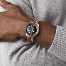 Rado Captain Cook R32137203 Automatic Men Watch worn by a man in a classic outfit, showcasing stainless steel case and ceramic bezel.