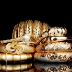 Showcase of NYC luxury jewelry inside an upscale Manhattan boutique, featuring gold and diamond pieces under soft lighting.
