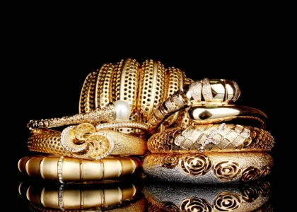 Showcase of NYC luxury jewelry inside an upscale Manhattan boutique, featuring gold and diamond pieces under soft lighting.
