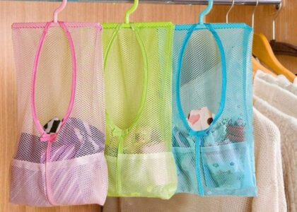 Trendy transparent mesh tote bag styled with summer essentials – sunglasses, perfume, and skincare – perfect for street style and festivals.