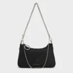 Ajmal Aristocrat Perfume for Women next to Charles & Keith Puffy Chain Bag in noir color, styled on a chic vanity.