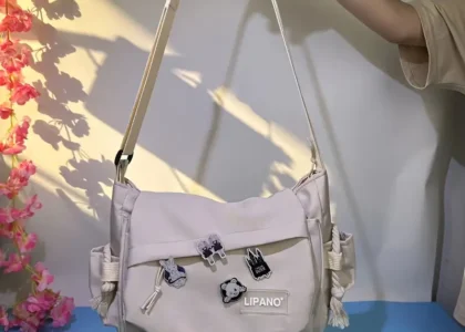 "Flat lay of trendy nylon bags styled with sunglasses and a phone, showcasing the popular nylon bag trend among Gen Z fashion lovers."