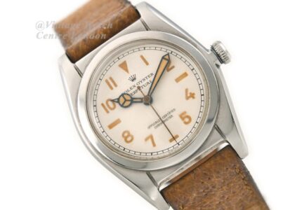 Vintage Rolex Oyster watch on leather strap styled with minimalist accessories for 2025 old-money aesthetic.