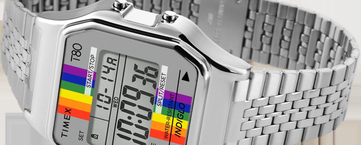 Timex T80 Rainbow Watch styled on wrist with retro outfit