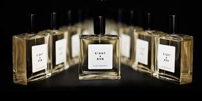 A flat lay of globally inspired fragrances with cultural elements from around the world