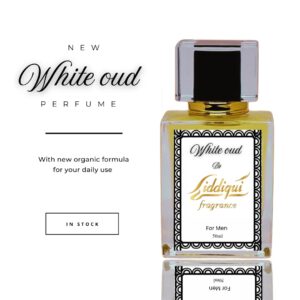 A minimalist perfume bottle of white oud fragrance placed on a marble tray with dried florals and soft lighting.