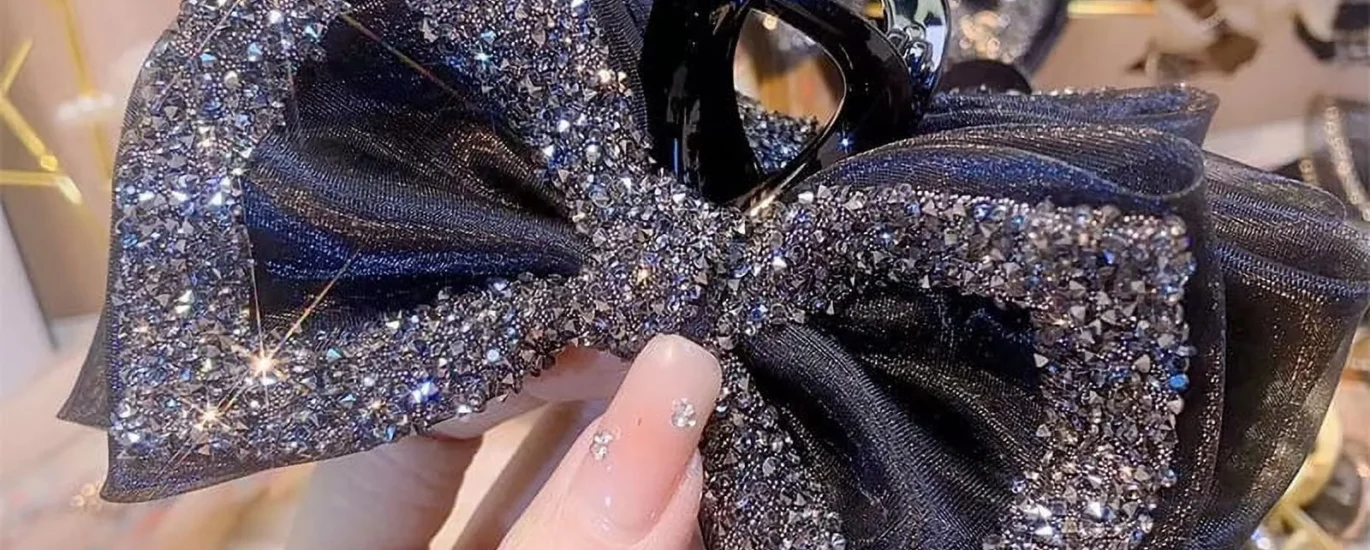 Rhinestone Bow Hair Clip styled on long wavy hair with pink coquette outfit