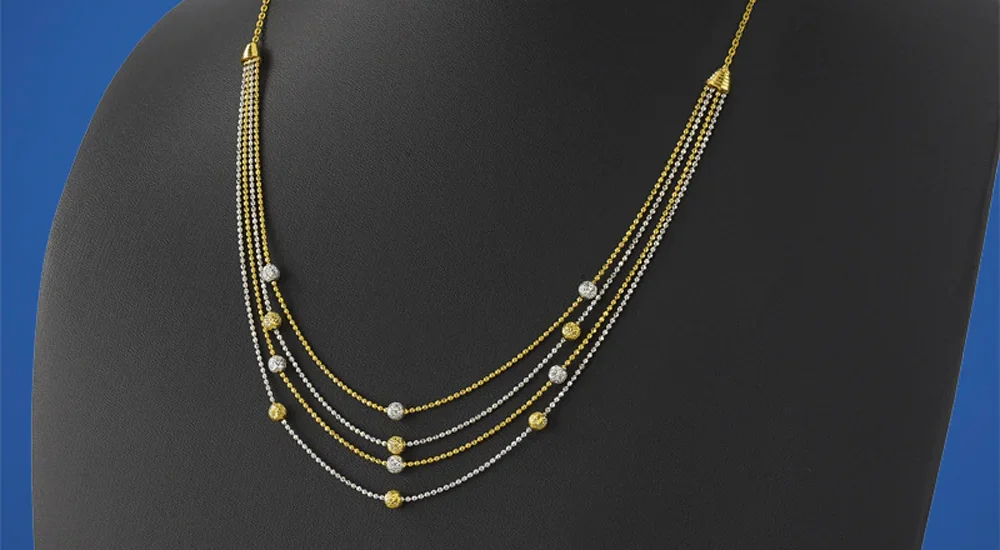 H&M Gold Layered Chain Necklace styled with casual white tee and jeans