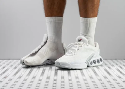 Nike Air Max Dn sneaker styled with Ajmal Aristocrat Perfume for Women in a modern streetwear outfit.