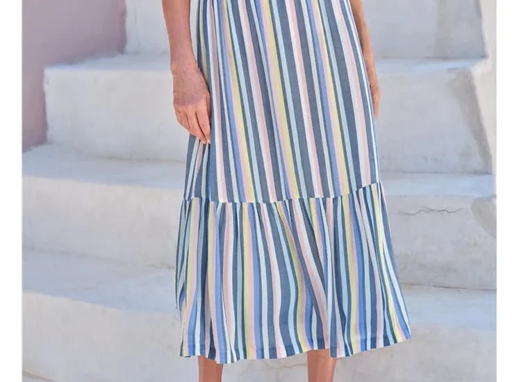 Flat lay of ballet flats, pastel cardigans, and ribbon hair ties – wear your tutu vibes summer fashion