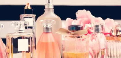 Under-$100 Perfume bottle on a vanity table with soft floral background