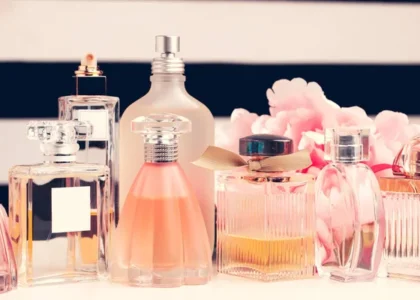Under-$100 Perfume bottle on a vanity table with soft floral background