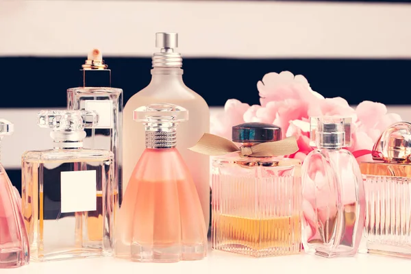 Under-$100 Perfume bottle on a vanity table with soft floral background